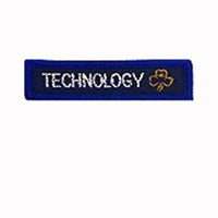 blue rectangle woven badge with the word technology sewn in white in capital letters and a gold trefoil after the writing