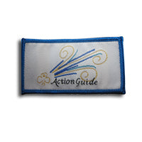 rectangular cloth bound badge with blue trim around the edges, trefoil in gold, Action Guide written in black and stripes of blue and gold on a white background