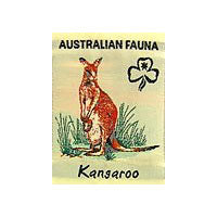 unbound badge with a brown kangaroo with grass around its legs with both the trefoil and the writing in black on a lemon background