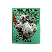 unbound badge with a tree branch with a koala with a joey on its back with the trefoil and writing in black on a mint green background