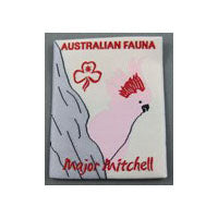 unbound badge with a pink cockatoo poking out from a tree branch with the trefoil and writing in red
