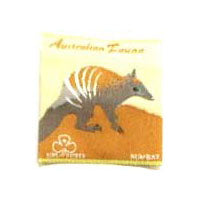 unbound badge with a numbat in grey and brown with the trefoil and writing in brown on a cream and brown background