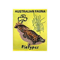 unbound badge with a platypus with the trefoil and writing in black on a yellow background