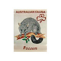 unbound badge with grey possum sitting on a tree branch with the trefoil and writing written in red on a off white background
