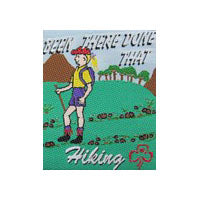 unbound cloth badge that shows a girl with a backpack hiking in the outdoors