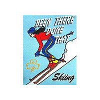 unbound cloth badge that shows a girl snow skiing down hill