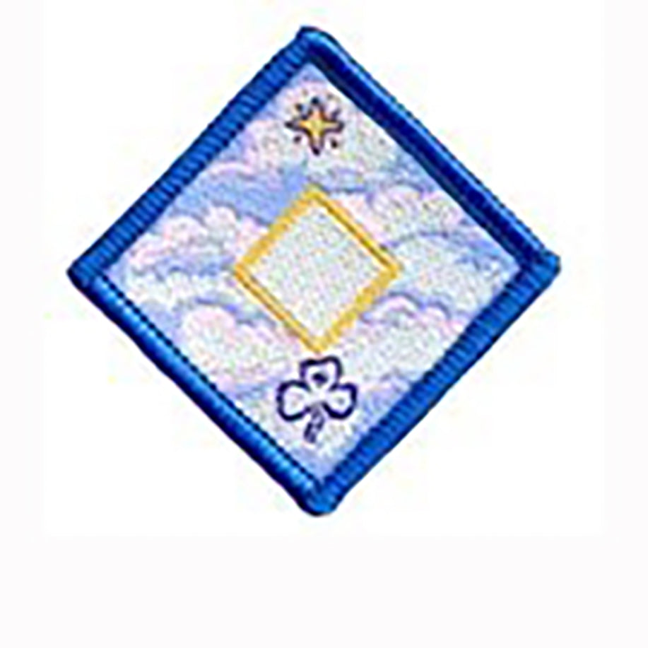 diamond shaped badge bound in royal blue with clouds on it with a gold diamond in the centre with a white middle in the smaller diamond