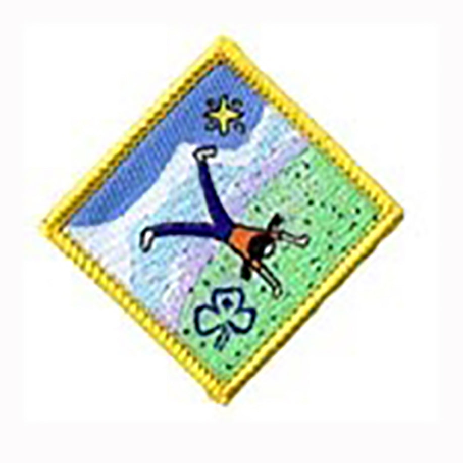diamond shaped bound in yellow badge with a girl doing a hand stand in the outdoors