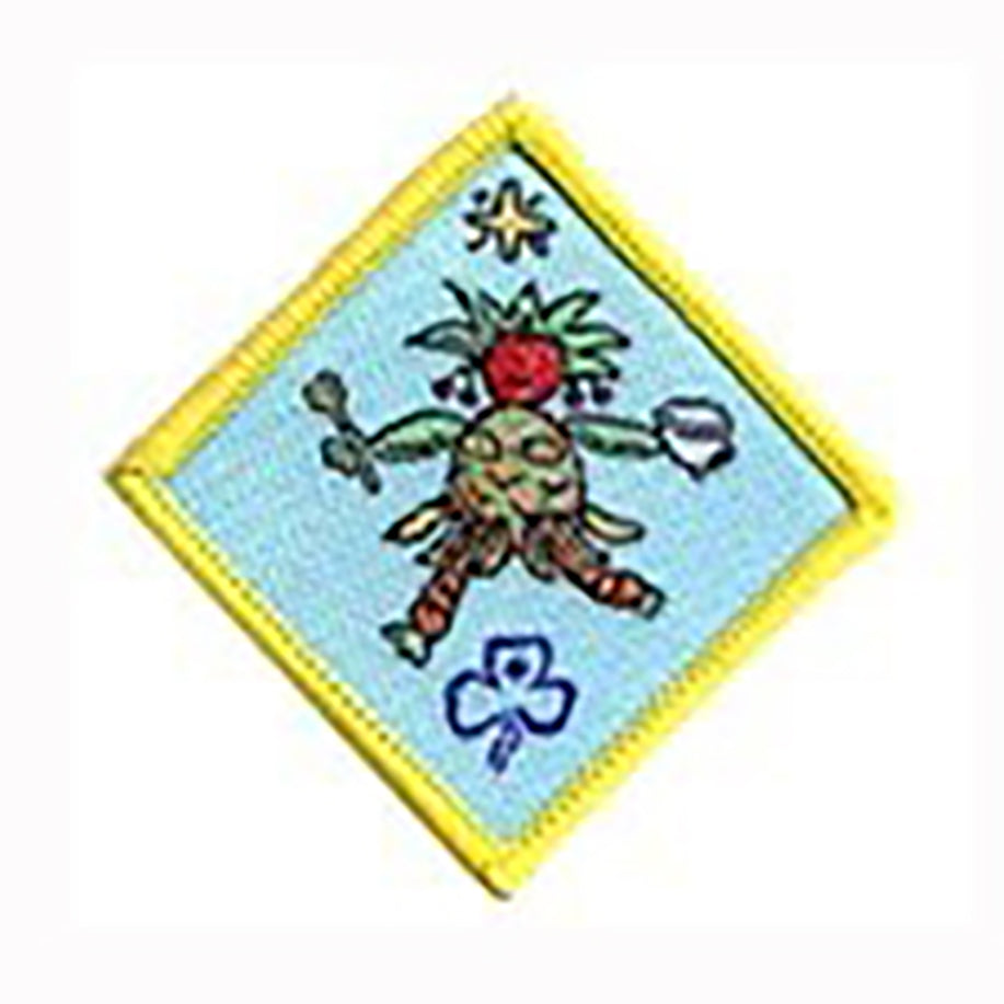 diamond shaped bound in yellow badge with a person made of different foods on it