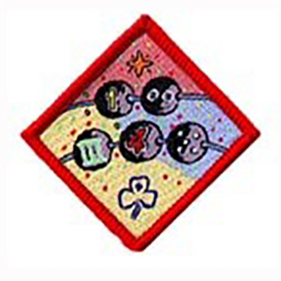 diamond shaped badge bound in red with two pieces of cord with beads with numbers on them
