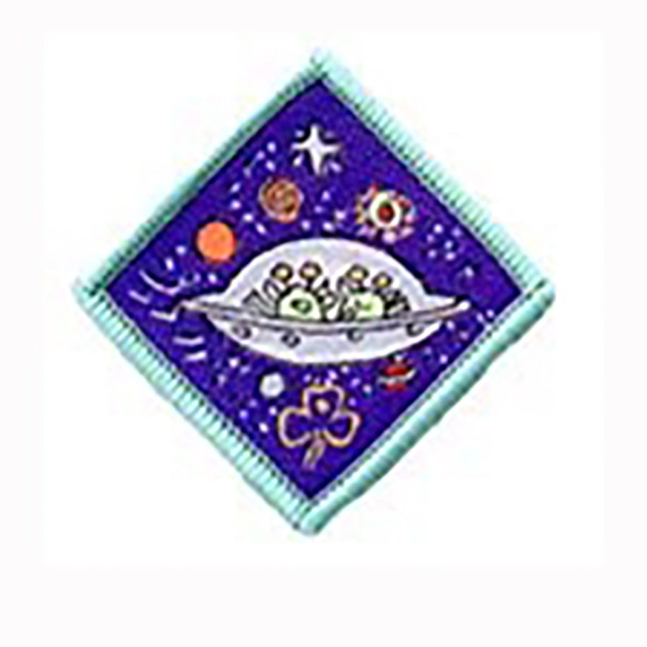diamond shaped badge bound in light green with two aliens in a space ship on a purple background with planets surrounding it
