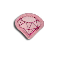 light pink badge in the shape of a diamond bound in light pink