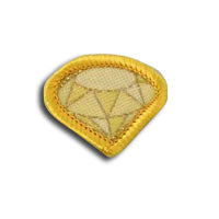 a yellow badge in the shape of a diamond bound in yellow