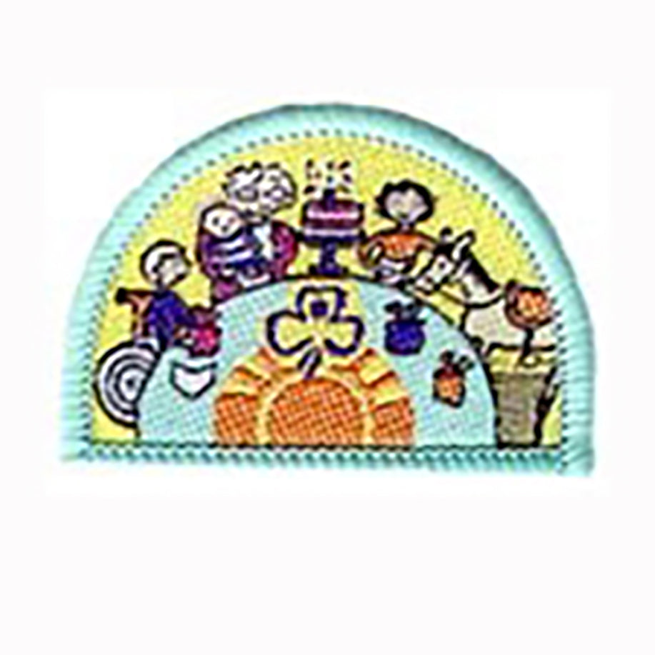a semi circle shaped badge bound in light green with girls around a table enjoying food