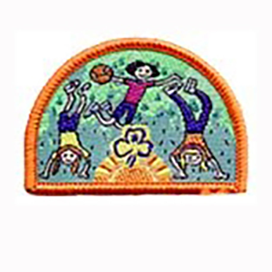 a semi circle shape badge bound in orange with girls playing in the outdoors