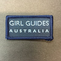 a blue rectangle bound badge with the words Girl Guides Australia on  it