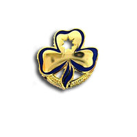 gold metal trefoil badge