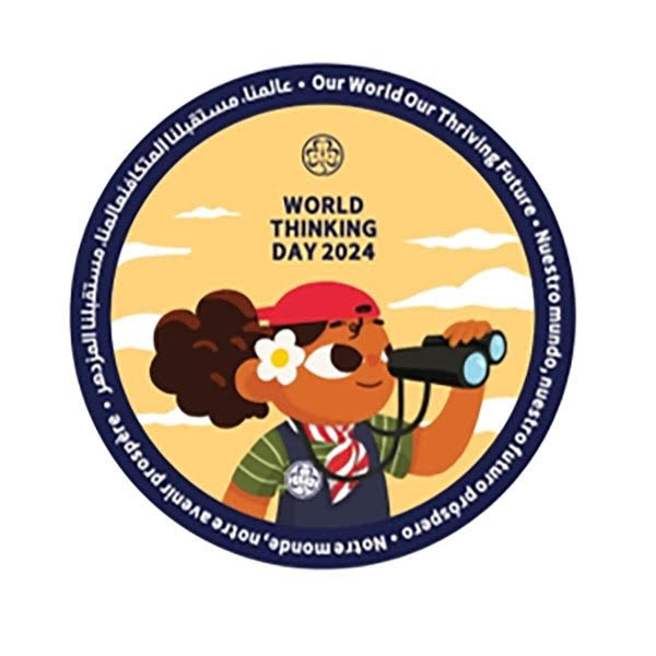 a round badge bound in blue with a girl with binoculars