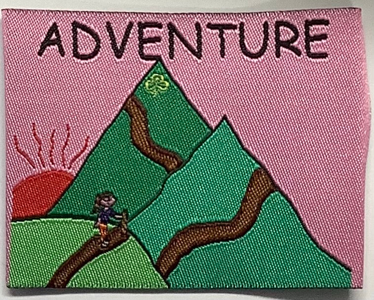 an unbound square badge with green mountains with a guide walking up the mountains with a pink background