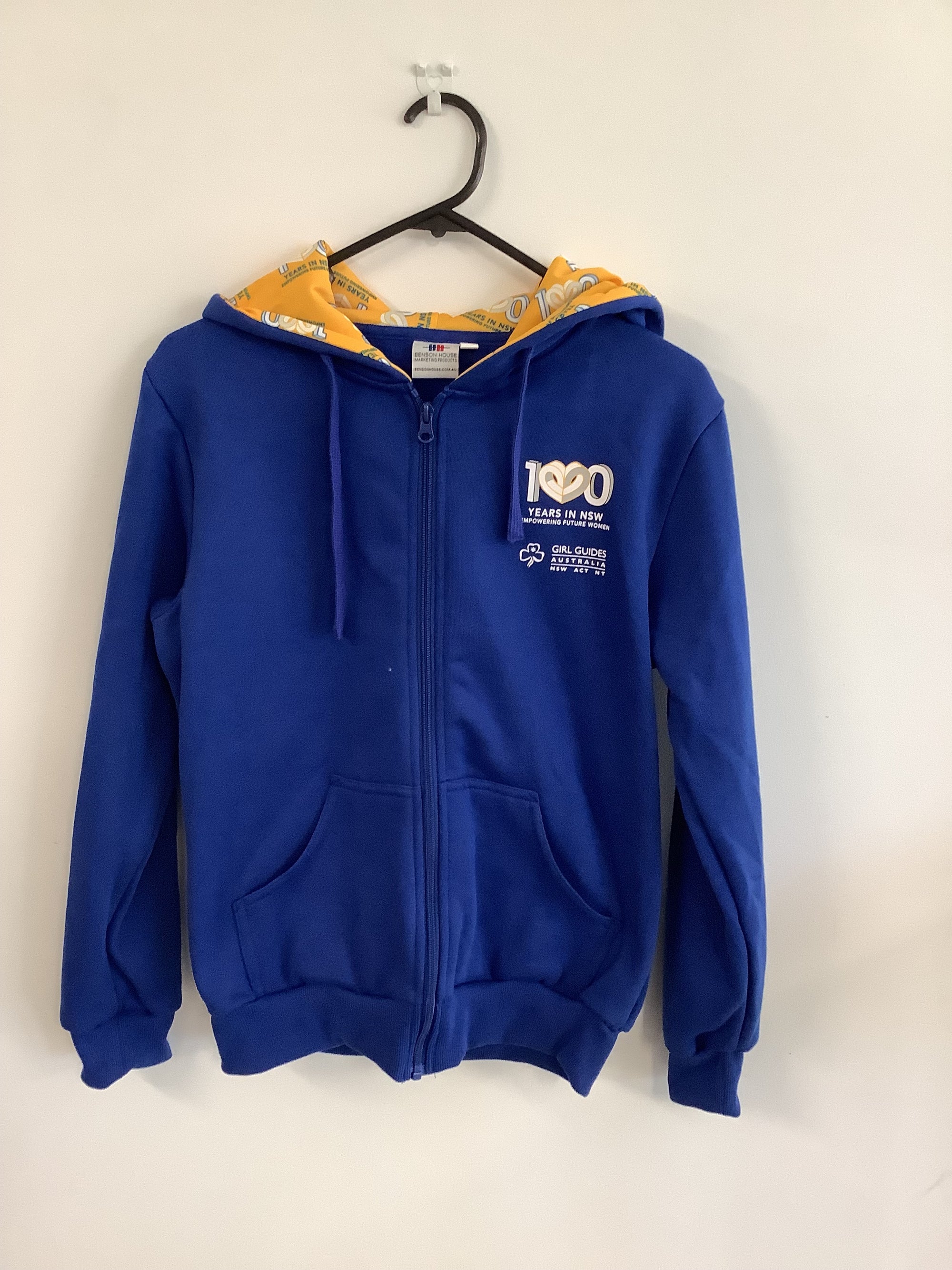 a blue hoodie with a zip front and yellow inside the hood