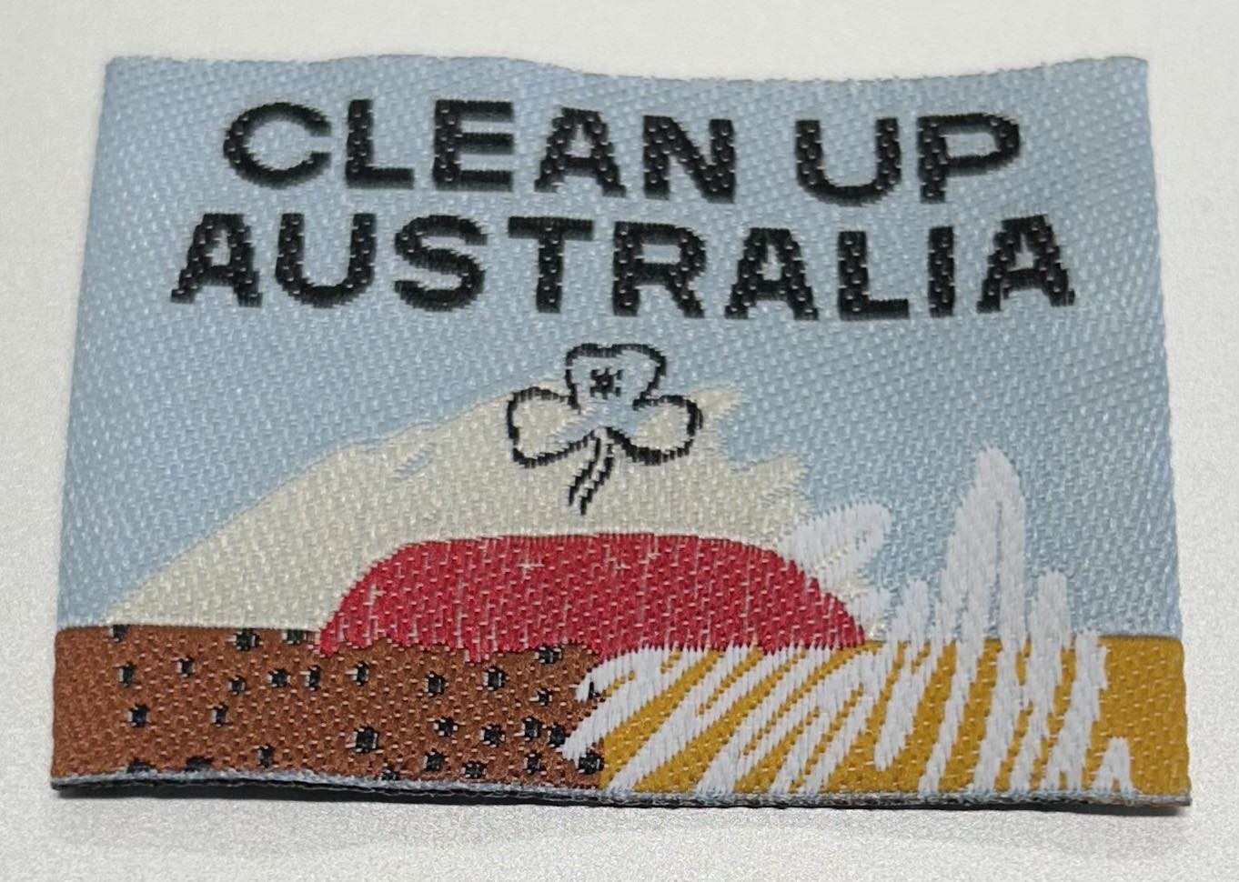 an unbound rectangular badge with Uluru with a light blue sky