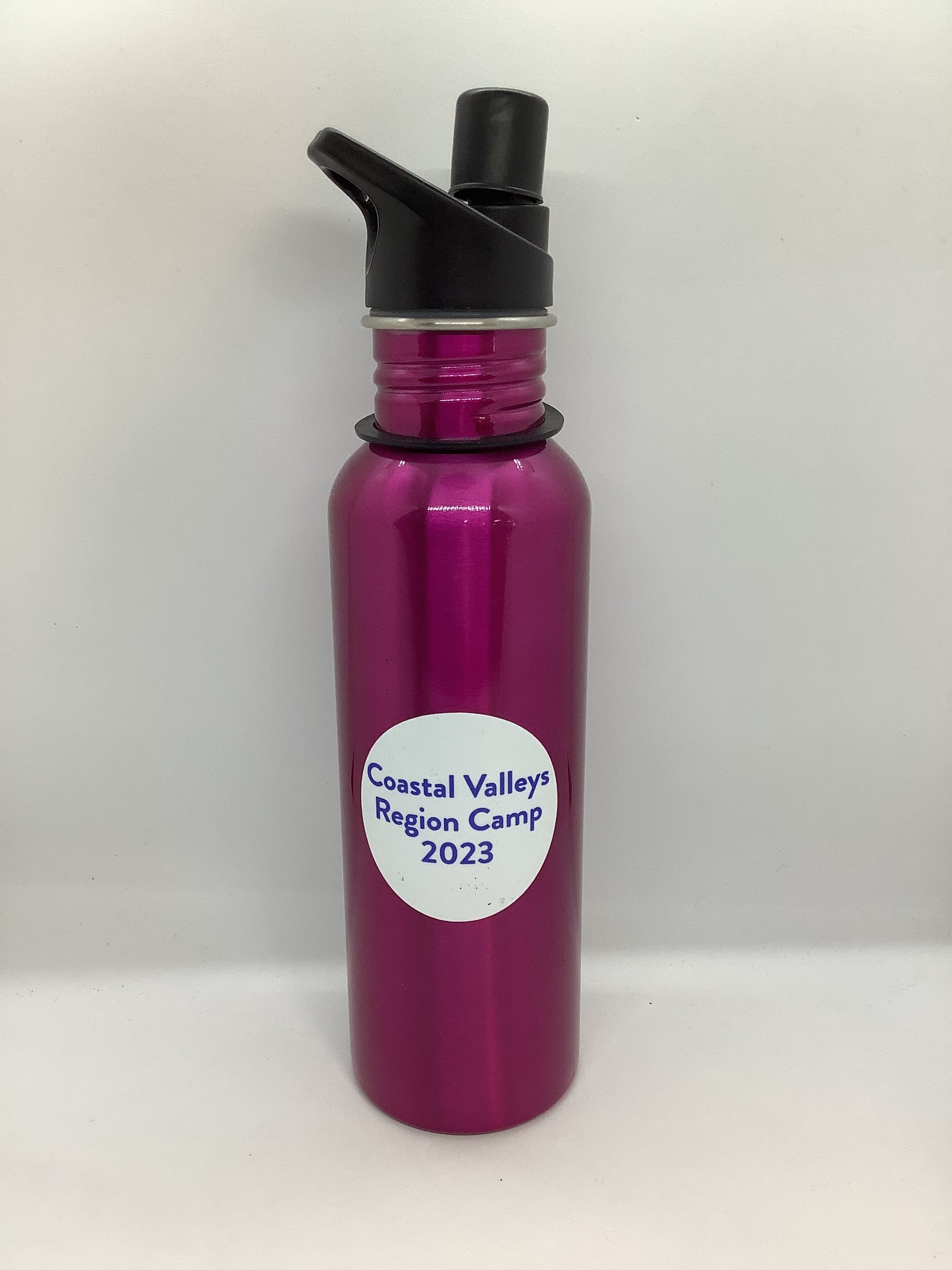 a pink aluminium drink bottle the CVR region camp 2023 sticker on the front