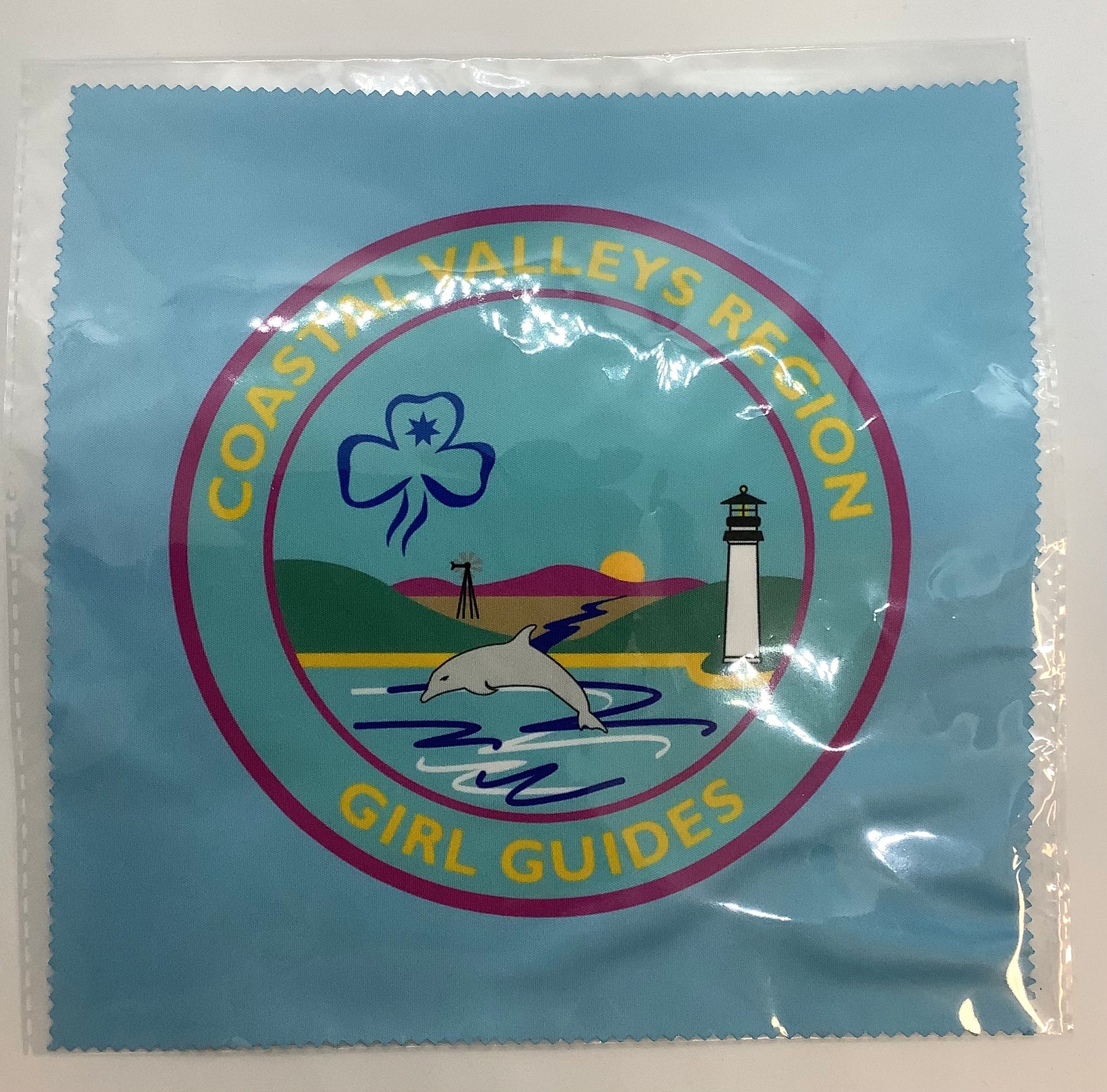 a light blue lens cleaning cloth with a picture of the CVR region badge