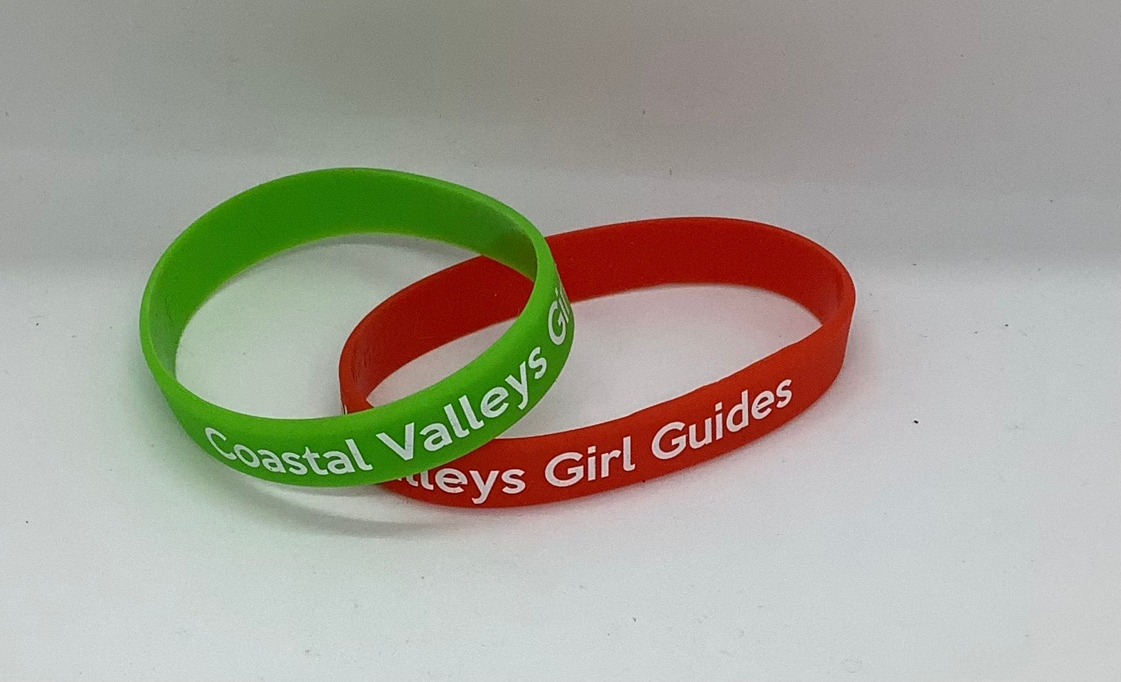 silicone wristbands in a variety of colours with coastal valleys girl guides in white