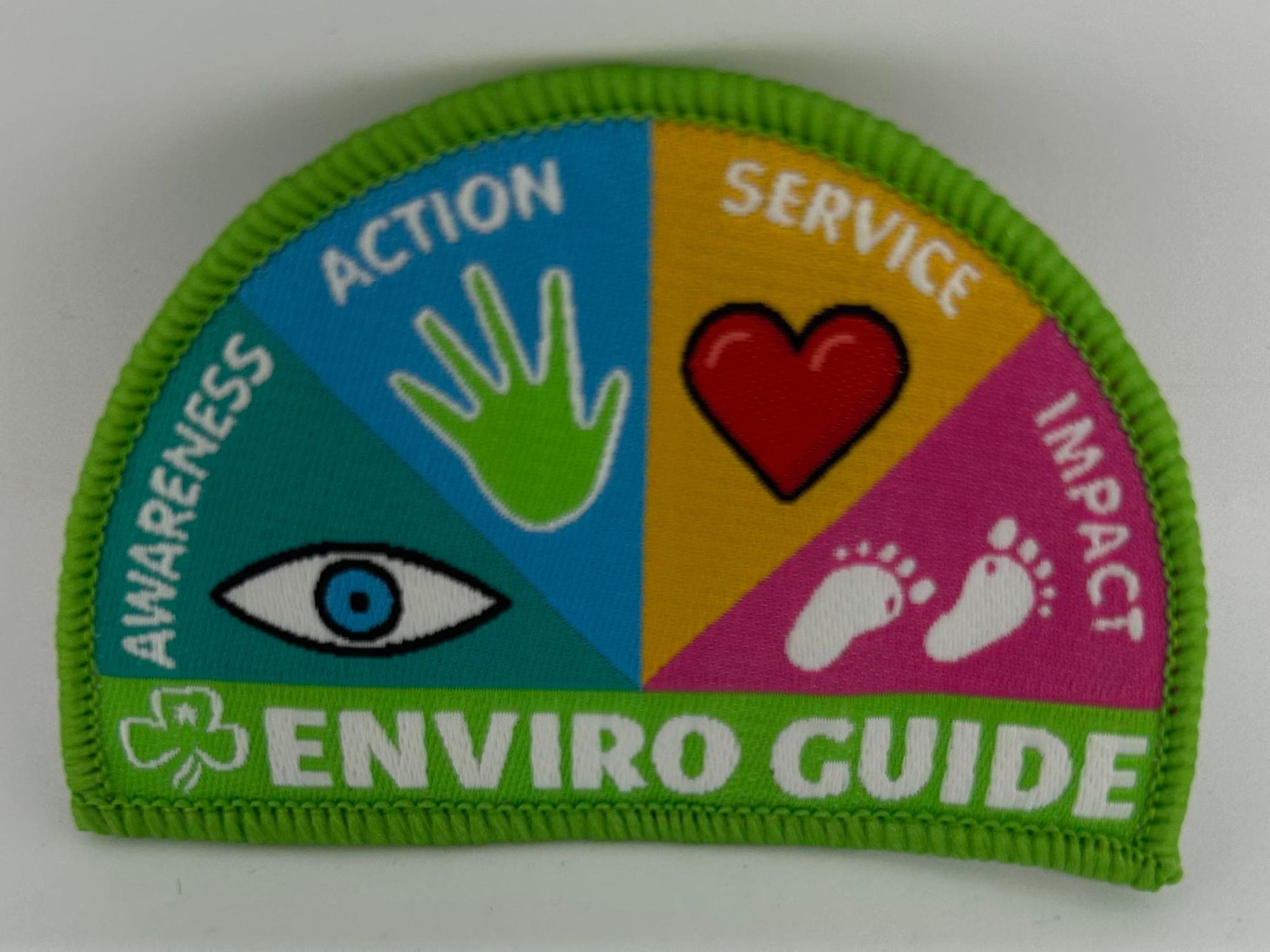 a semi circled badge bound in green with enviro guide written on it
