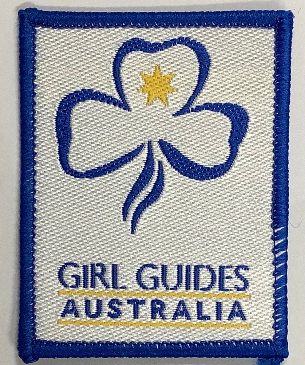 a rectangle badge bound in blue with the trefoil and girl guides Australia 