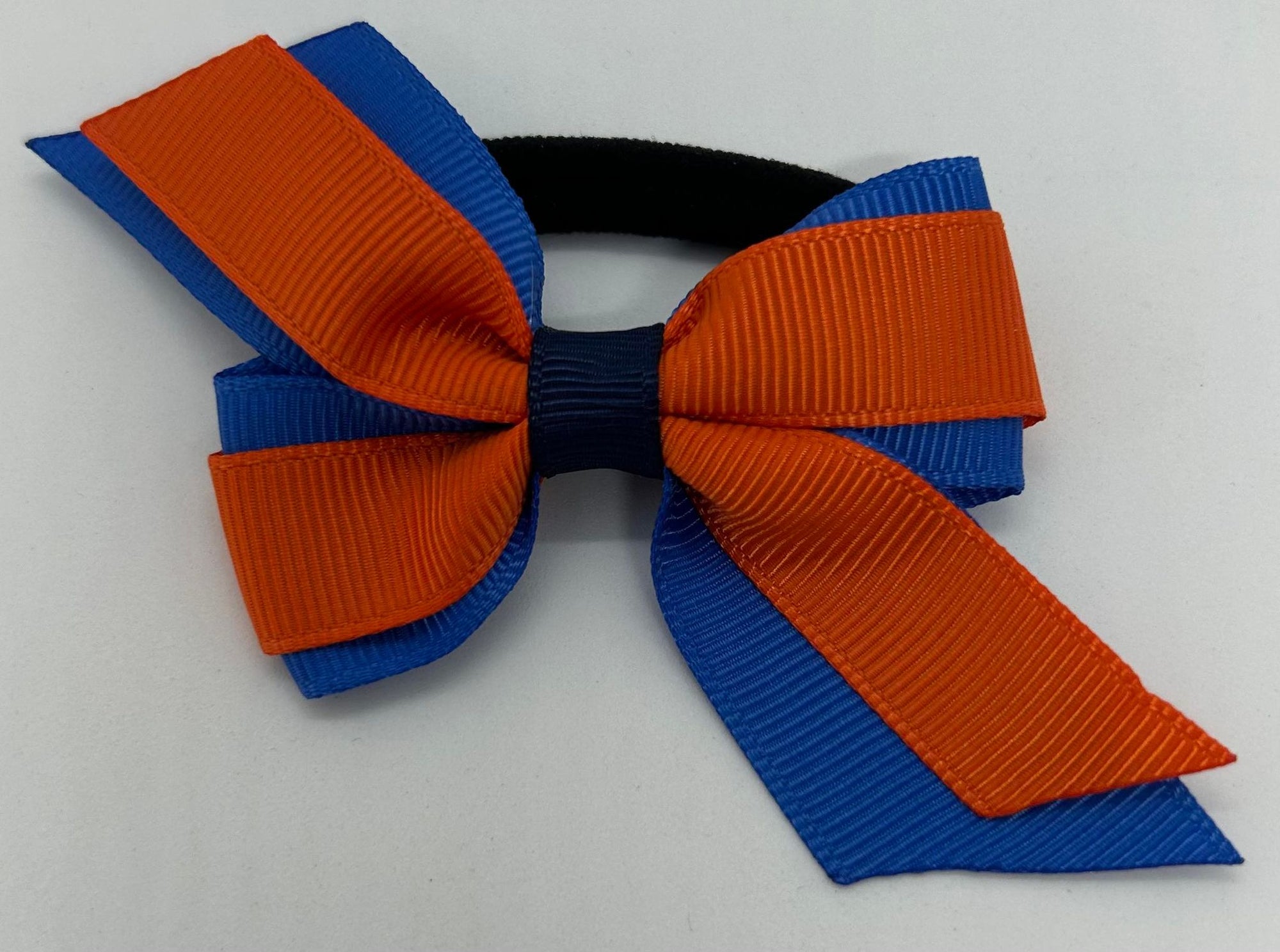 a small hair bow in guide colours