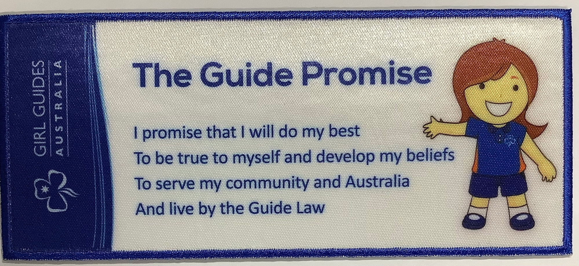 a rectangle shaped badge that is sturdy enough to be used as a bookmark with the Guide promise and a guide