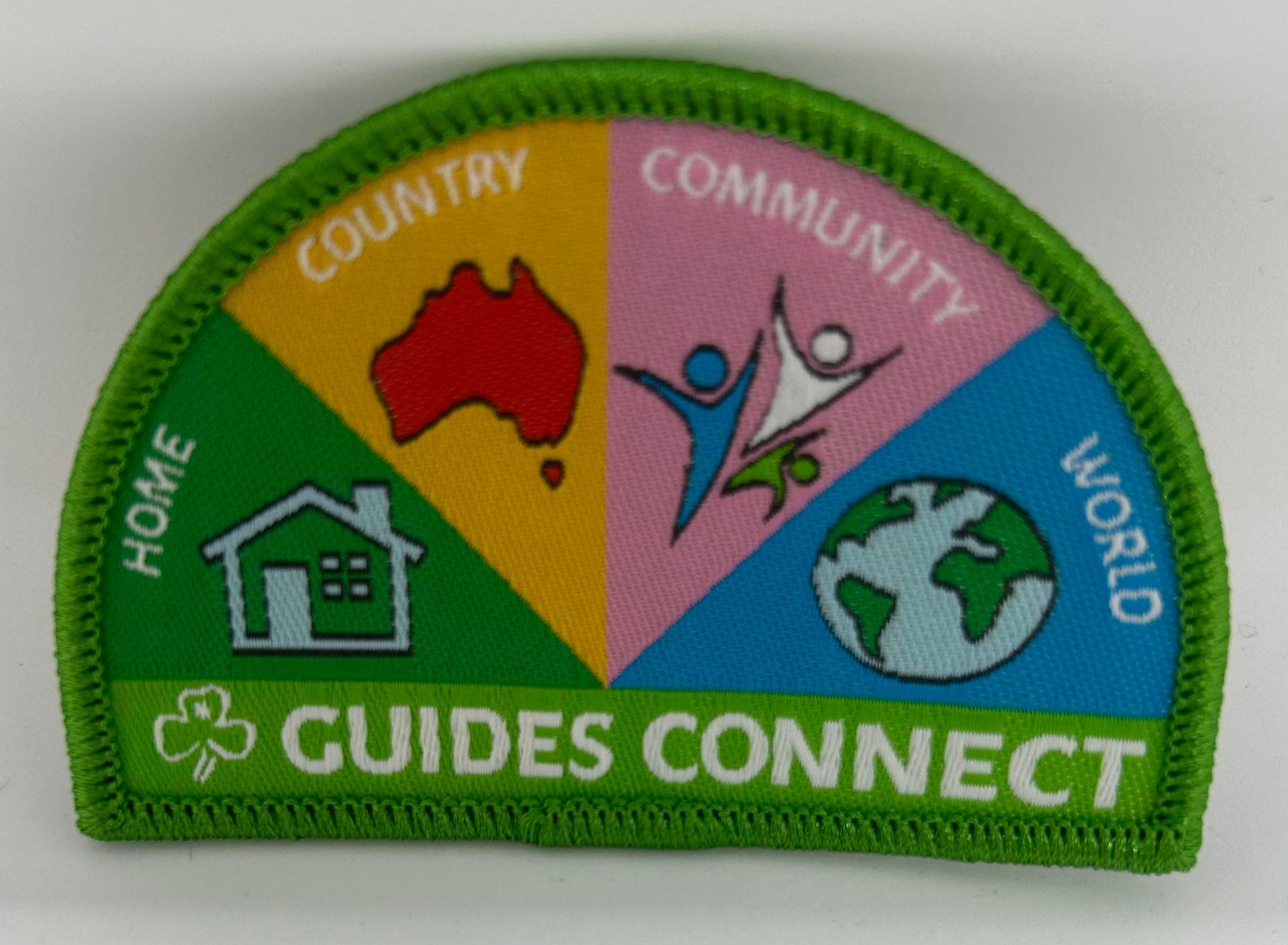 a semi circled badge bound in green that has the components of the syllabus on it