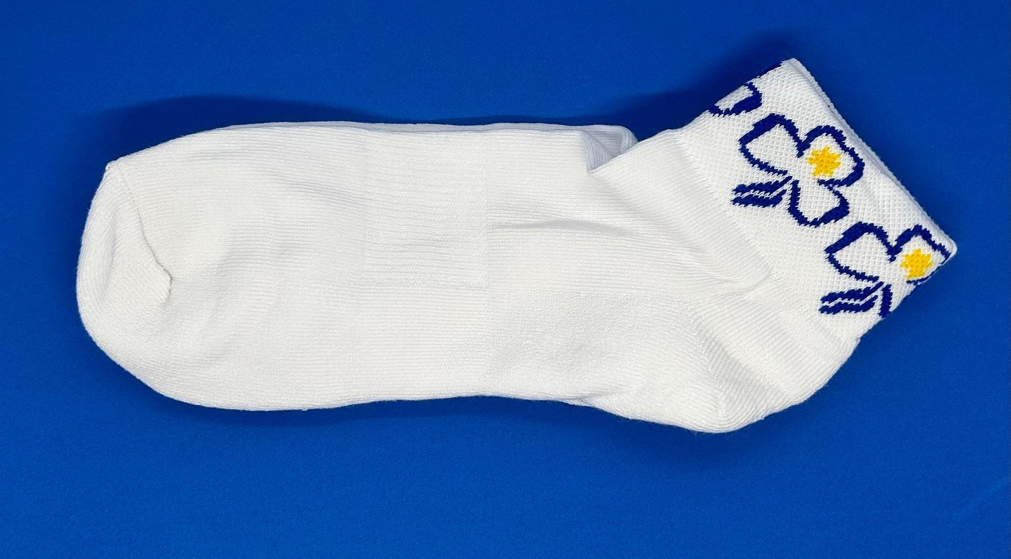 white ankle socks with the trefoil around the top