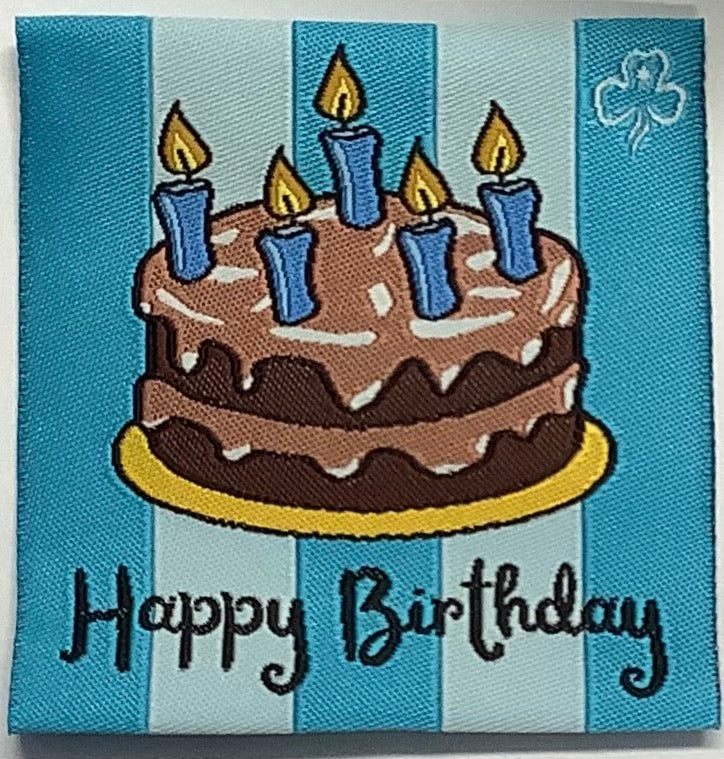 a square unbound badge with blue stripes and a chocolate cake with candles