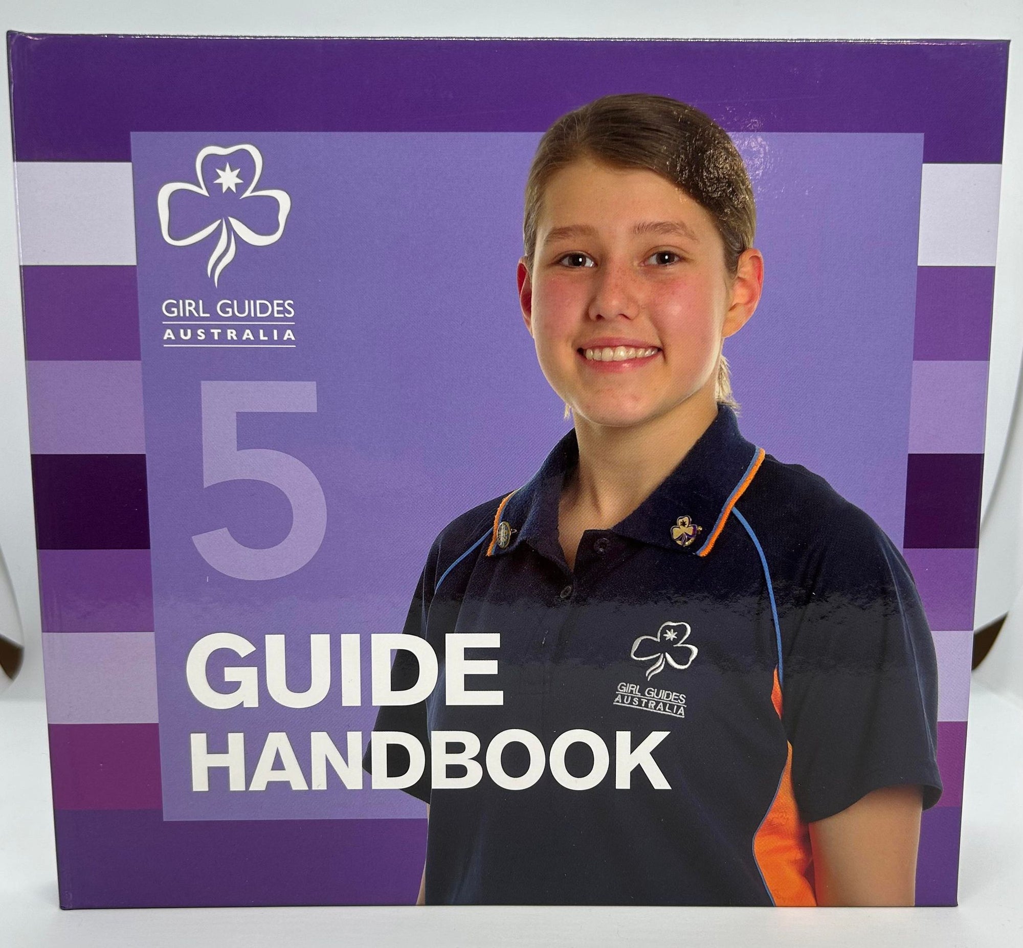 the purple number 5 handbook for senior guides that has a hard cover