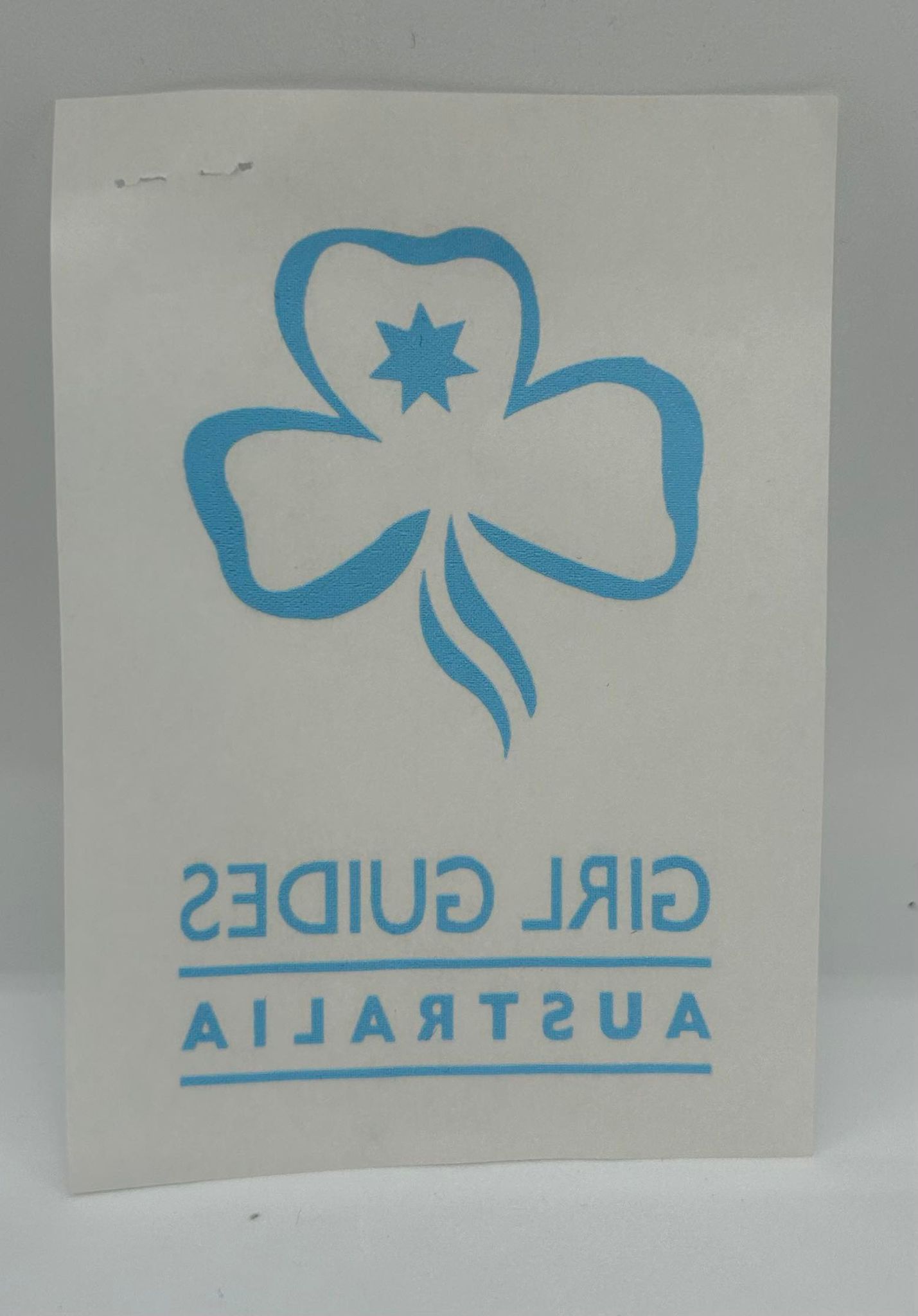an iron on trefoil with girl guides Australia written underneath