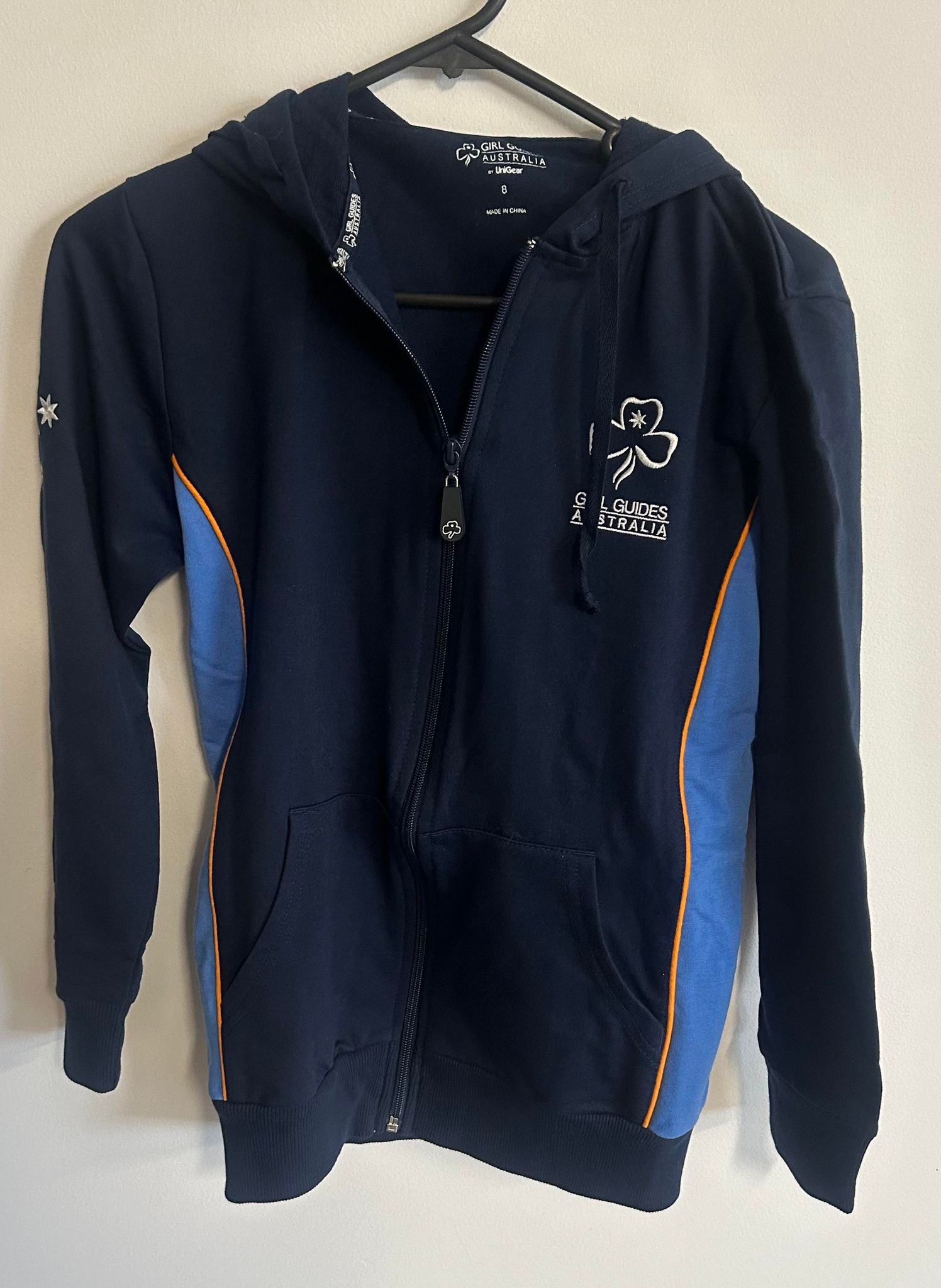 a navy blue hoodie with light blue in the side inserts