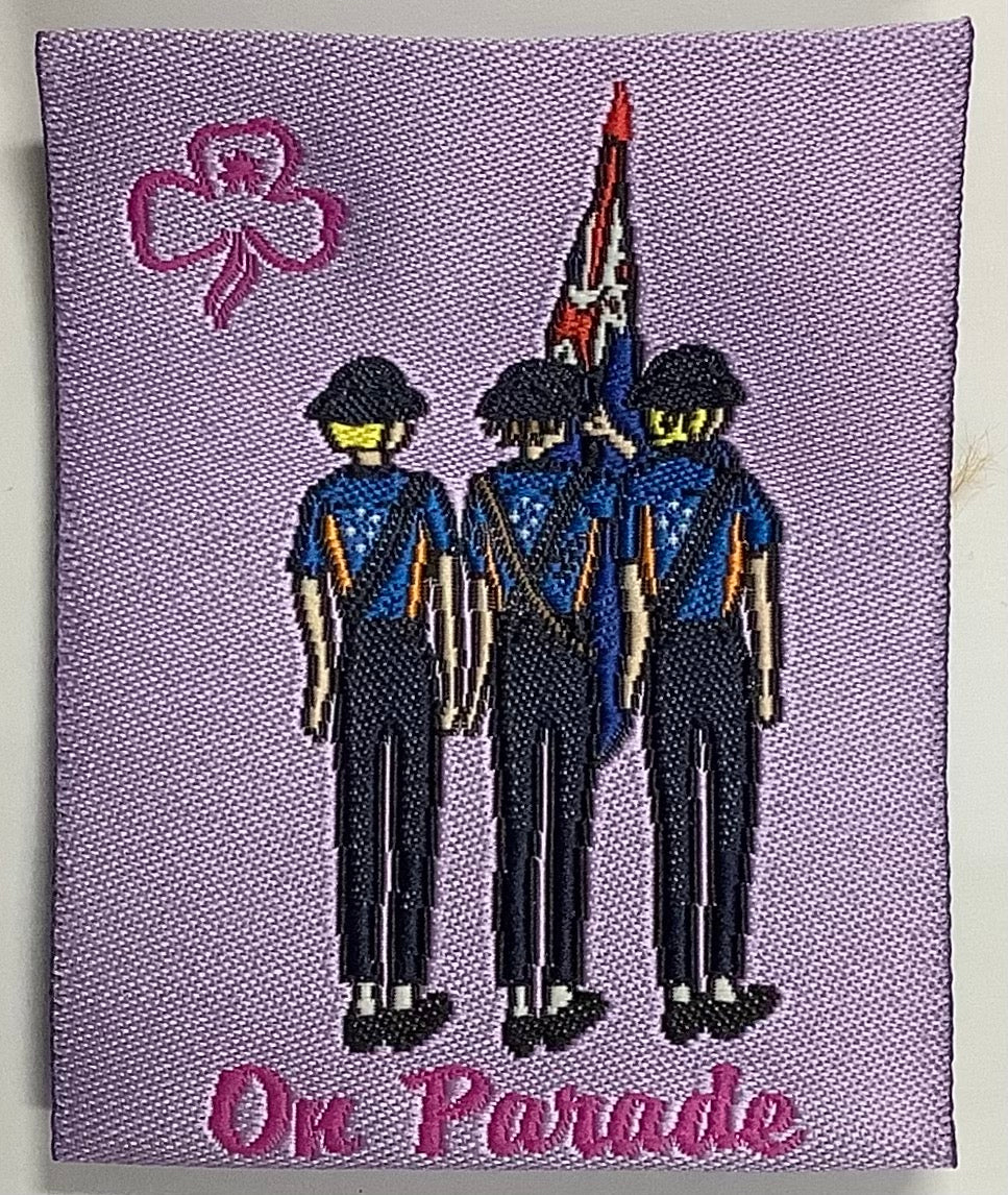 a square unbound badge with a pink background with three guides and an Australian flag