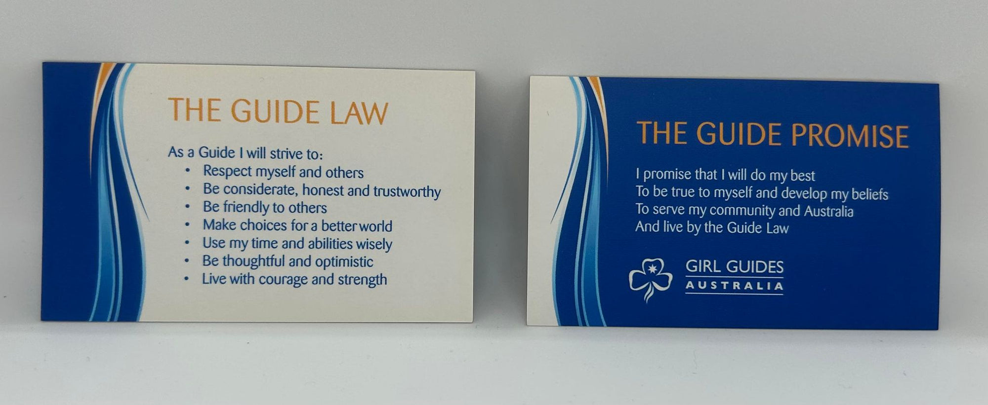 a business size card with the promise on one side and the law on the other