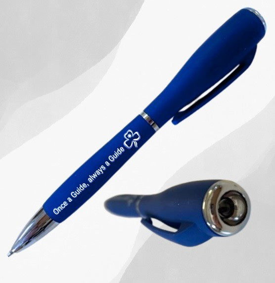 a blue coloured pen with torch that says once a guide always a guide on the outside barrel of the pen
