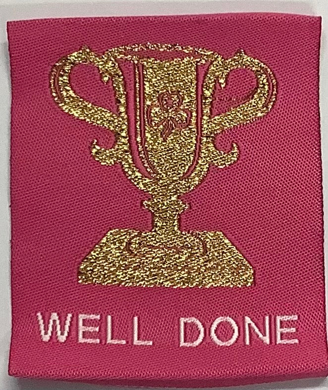a square pink unbound badge with a gold trophy
