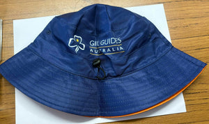 Blue bucket hat with 'Girl Guides Australia' logo and B2B branding on the blue side. On the range side there are pictures of the mascots Echo and Tilly
