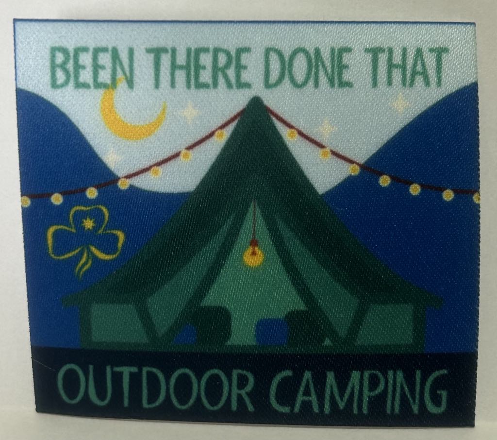an unbound square badge with a bell tent with string lights outside with the words been there done that outdoor camping in green