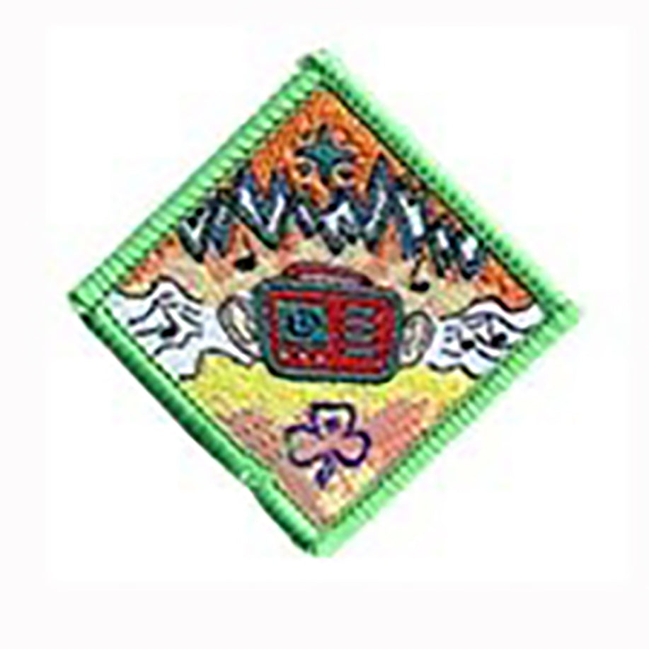 diamond shaped bound in green badge with a radio with ears on it in the middle of the badge