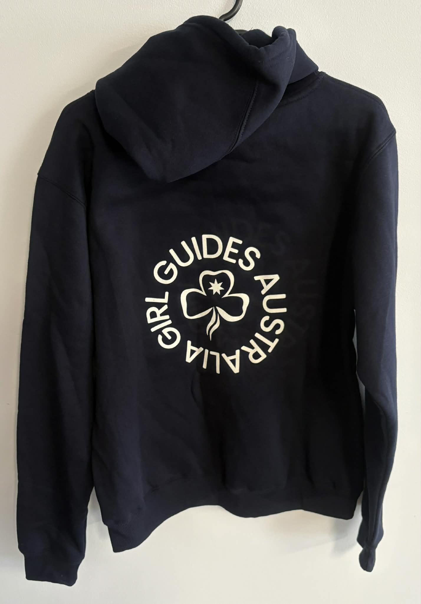 Navy hoodie with 'Girl Guides Australia' text on a white background