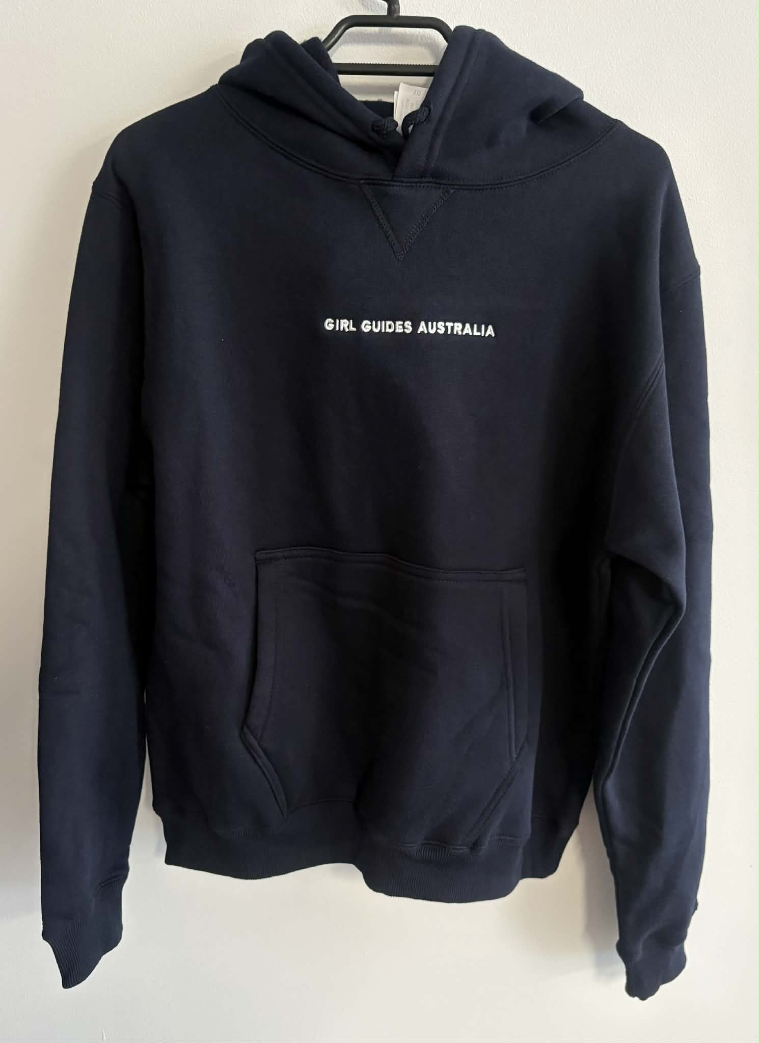 Navy hoodie with 'Girl Guides Australia' text on a white background