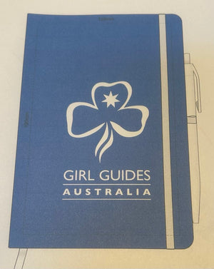 a blue A5 notebook with the trefoil and Girl Guides Australia on the front as well as on the pen