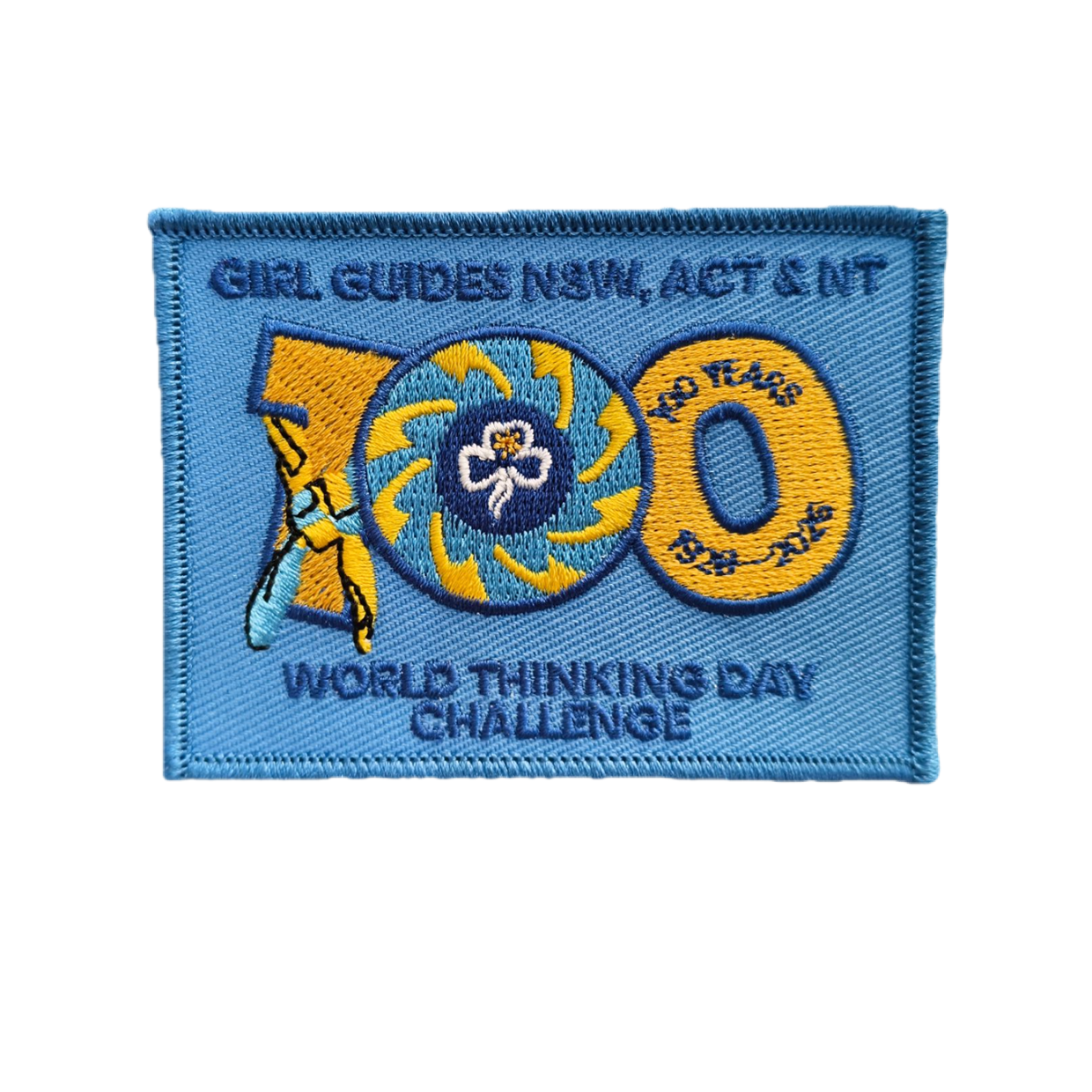 Square blue bound badge with Girl Guides NSW ACT NT 100 years World Thinking Day Challenge