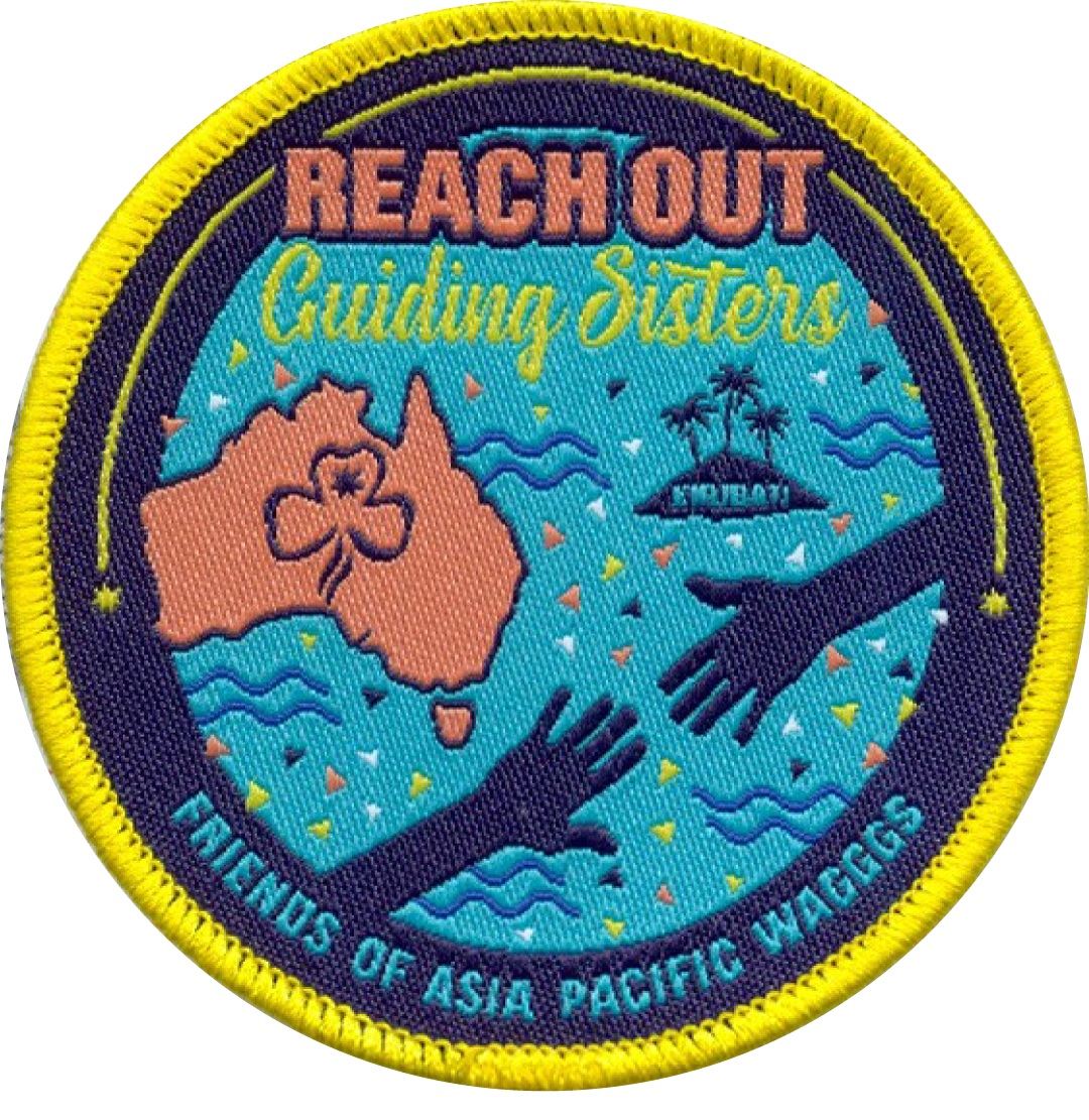 Circular badge with 'Reach Out Guiding Sisters' text and illustrations of Australia and hands on a blue background.